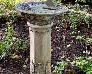Heavy metal sundial and faux concrete stand