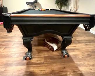 Brunswick pool table with black felt top