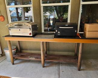 Outdoor pizza oven with accessories, pellet grill.