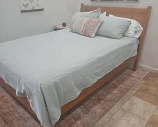 Queens size bedding, queens size mattress, headboard, pillows, wall art.