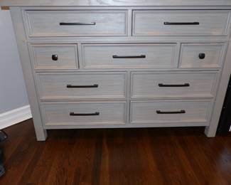 Gray wood bedroom set with storage in bed, night table, dresser & chest
