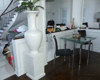 Tall white vase on pedestal base