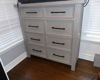 Gray wood bedroom set with storage in bed, night table, dresser & chest