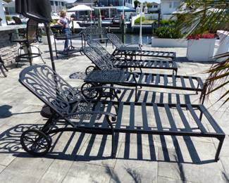 4 outdoor cast aluminum chaise lounges (no cushions) and 2 side tables