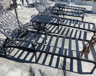 4 outdoor cast aluminum chaise lounges (no cushions) and 2 side tables