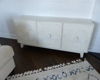 White wood sideboard with decorative carving
