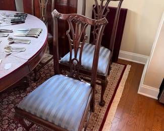 B41 - $950. Round Wooden Dining Table with 8 Chairs. Table is 5' round x 29.5" tall. Floor to bottom of table lip is 25.5".  Table has 3 leaves. 2 - 18" leaves. 1 - 13" leaf. Includes table pads for all. Overall very good vintage condition, a few surface marks not deep gouges. Chairs are all sturdy with varying wear on cushions and wood.  