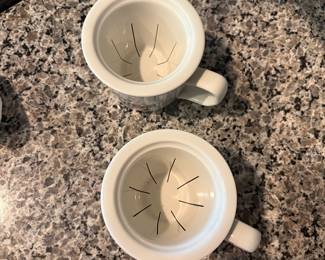 B72 - $20. Pair of Pillivuyt Violet Tea Mugs. 1 has a lid. 