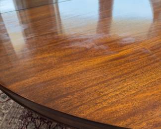 B41 - $950. Round Wooden Dining Table with 8 Chairs. Table is 5' round x 29.5" tall. Floor to bottom of table lip is 25.5".  Table has 3 leaves. 2 - 18" leaves. 1 - 13" leaf. Includes table pads for all. Overall very good vintage condition, a few surface marks not deep gouges. Chairs are all sturdy with varying wear on cushions and wood.  