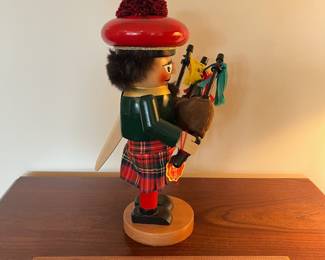 B97 - $65. Steinbach Scottish Bagpipe Player Nutcracker. Measures 12" tall. 