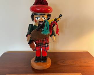 B97 - $65. Steinbach Scottish Bagpipe Player Nutcracker. Measures 12" tall. 