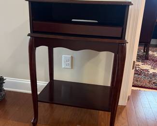 B16 - $50. Small Side Table or TV Stand with single slide out tray. Measures 23.75". 15.75" x 34.75" tall. 