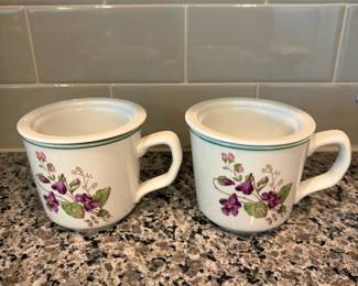 B72 - $20. Pair of Pillivuyt Violet Tea Mugs. 1 has a lid. 