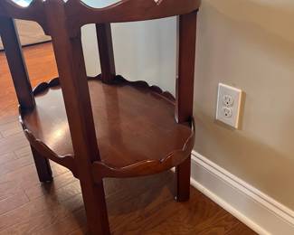 B22 - $145. Oval Two Tiered Wooden Side Table. Top level has glass piece for protecting the wood. Measures 19" x 27.75" x 28.25" tall. 