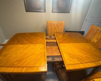 American Drew table showing stored leafs