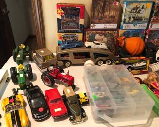 Antique toy trucks, tractors, and cars