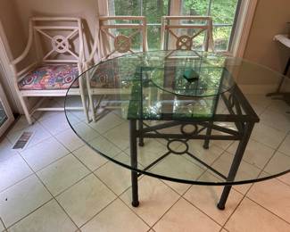 Glass topped metal table with lazy Susan; 6 rattan chairs