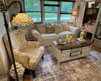 Nicely furnished family room with deep seated&nbsp;ivory upholstered couch- incredibly comfortable!