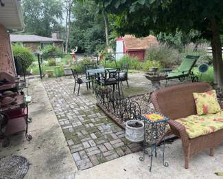 Larger than usual back deck filled with patio furniture! Several different sets