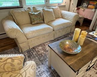 Nicely furnished family room with deep seated&nbsp;ivory upholstered couch- 8'x40" seat depth