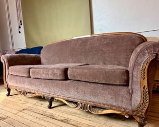 Brown velvet sofa with stunning wood detail