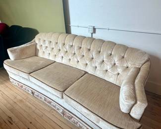 Cream velvet sofa with skirt detailing