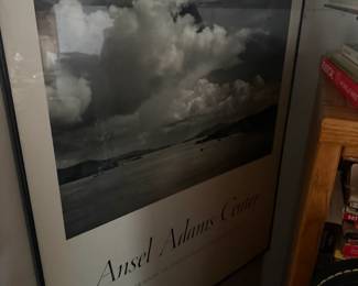 Framed Ansel Adams landscape photography print with dramatic clouds