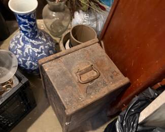 Decorative vases, ceramic mugs, vintage metal lockbox, and silk flower arrangements