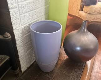 Assorted decorative ceramic and glass vases in various sizes and colors