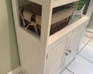 White storage cabinet with louvered doors and open shelving