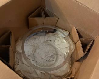 Boxed china plates and serving dishes packed in cardboard dividers