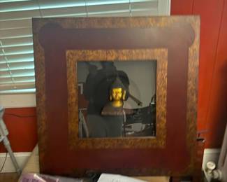 Large framed oil painting in ornate carved wood frame with open book display
