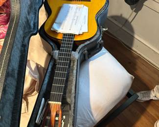Electric guitar in hard shell case with original paperwork