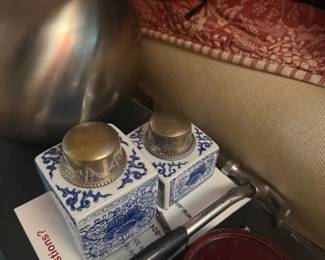 Vintage blue and white porcelain condiment set with silver lids on decorative tray