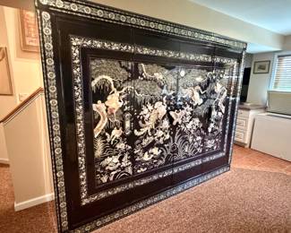 large vintage Korean black lacquer wardrobe cabinet featuring intricate mother-of-pearl and abalone inlay, known as Najeonchilgi