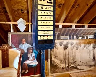 vintage illuminated eye-testing chart, commonly referred to as an optotype light box cabinet, mounted on a metal floor pedestal