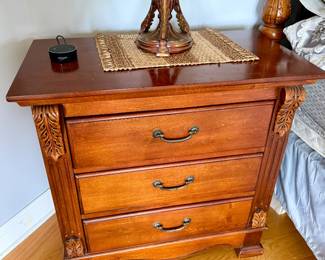 traditional solid wood 3-drawer nightstand with carved leaf accents and antique-style metal handles