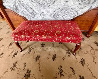 vintage upholstered accent bench featuring a rich red floral fabric and classic dark wood cabriole legs