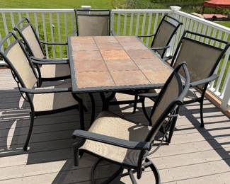 Tile top outdoor table with 2 swivel and 4 regular chairs