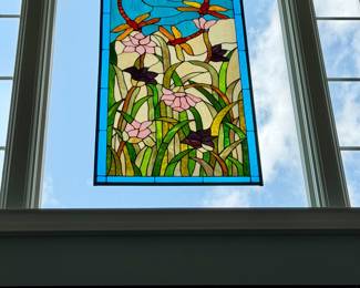 Tiffany-style stained glass window panel featuring dragonflies, water lilies, and a pond scene