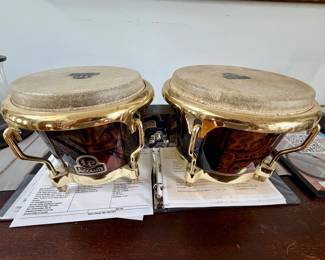 pair of Latin Percussion (LP) Accents Tribal Finish Bongos featuring polished gold-toned hardware