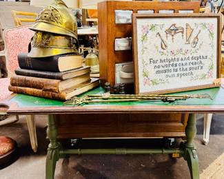 Antique books, firefighter helmets, coffee table