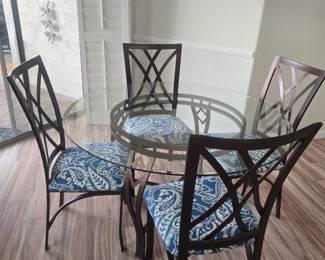 Iron glass top table/four chairs