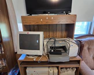 Computer station with an Onn Roku flat-screen TV, a KDS CRT monitor, an HP Business Inkjet 2200 printer with extra tray, a vintage Evergreen Research beige desktop PC tower, external drives, a fax machine, and a Canon CP-220 compact photo printer in the box.