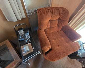 Mid-century style swivel lounge chair in burnt-orange button-tufted chenille, shown with a black and chrome rolling cart holding two boxed MK-080 microphones and a vintage Boston wall-mount pencil sharpener on a wood board.