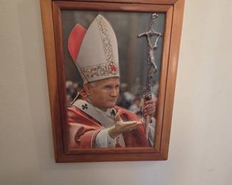 Framed color portrait of Pope John Paul II in vestments with crosier, in a solid wood frame. A fitting piece for this Polish Catholic household collection.