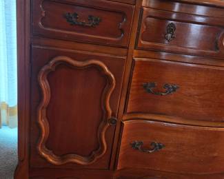Front view of the same dresser showing the full drawer and cabinet layout.