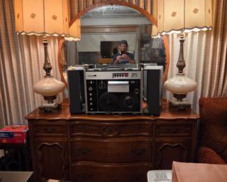 Another view of the same stereo system and matching table lamps on the dresser.