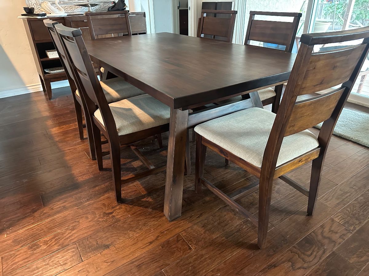 Six chairs tuck in completely on sides measures 40 x 73” without additional draw leaf ends that add 13.5 inches each