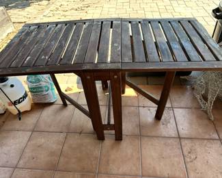 Slat design  table shown open 24.5 wide by 10 inches when closed and 50” if opened